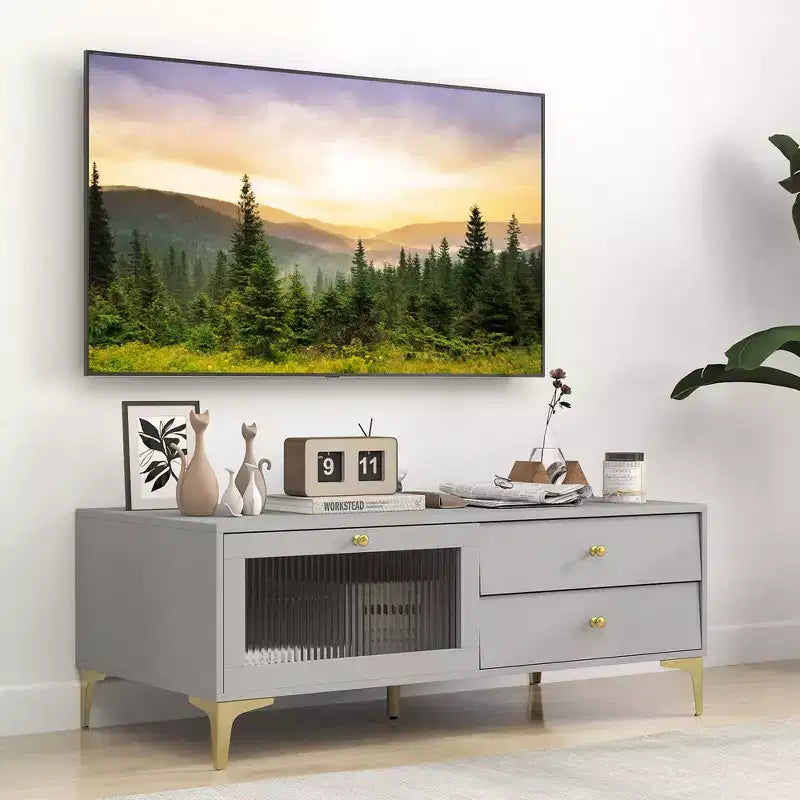 Mobile TV grigio con anta a ribalta e 2 cassetti, adatto per TV fino a 55"
